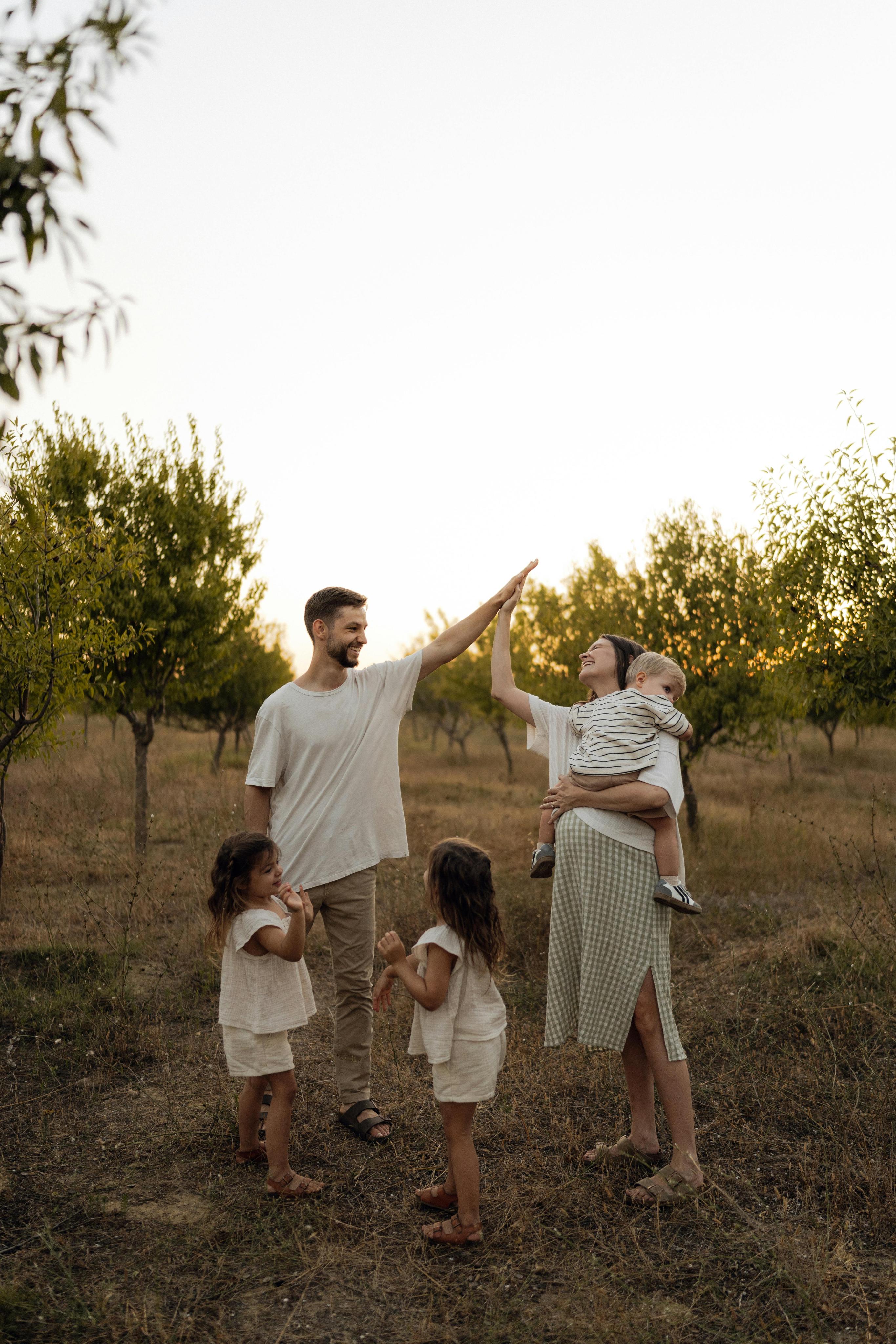 Family enjoying time in an orchard